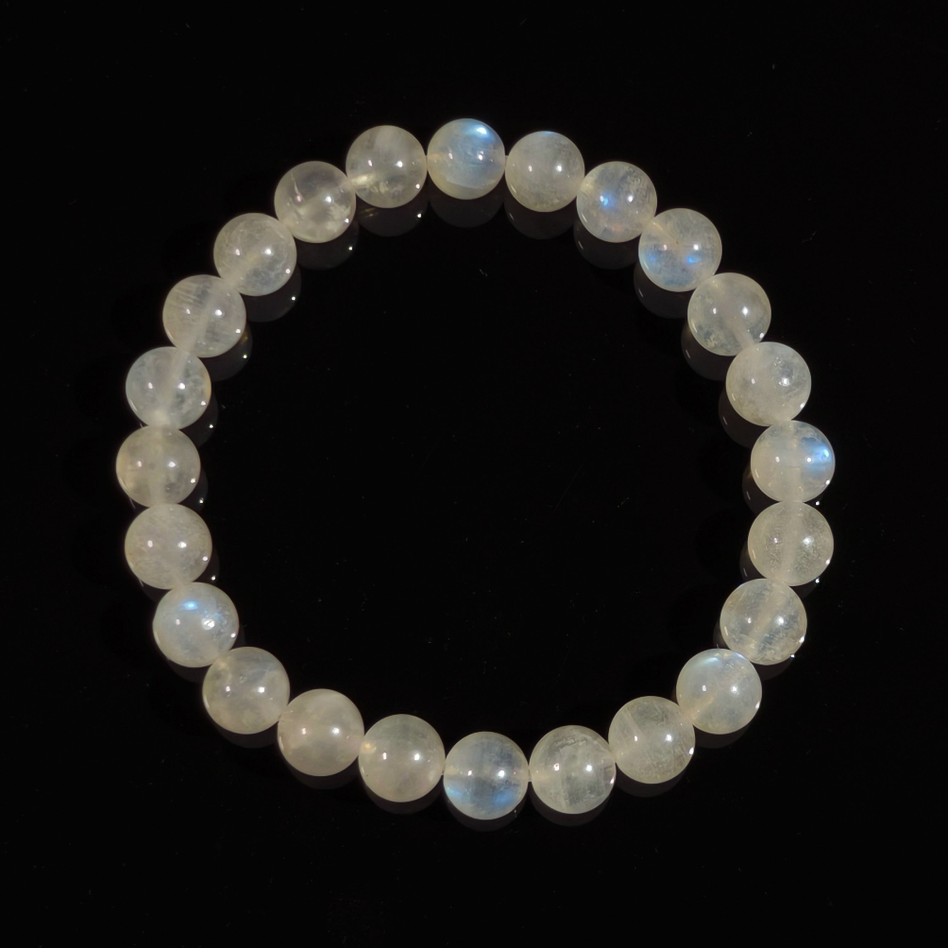 Moonstone bead bracelet with natural blue sheen, symbol of calm and intuition.